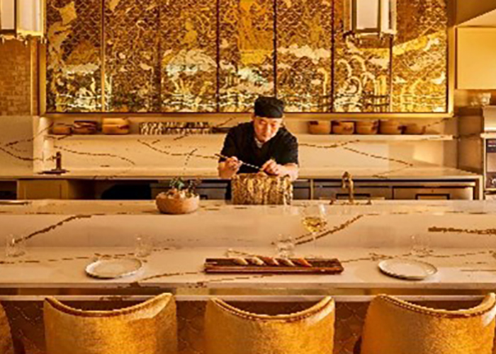 Chef preparing a meal in an Asian-themed restaurant