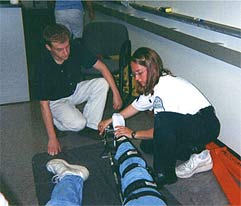 photo of paramedics demonstrating traction
