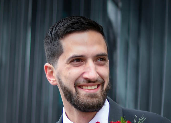 a man in a suit smiling