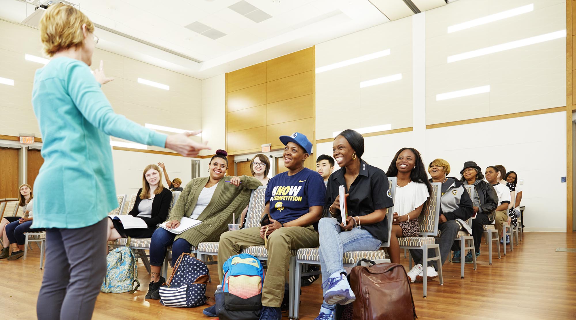 a professor giving a lecture to a group of students