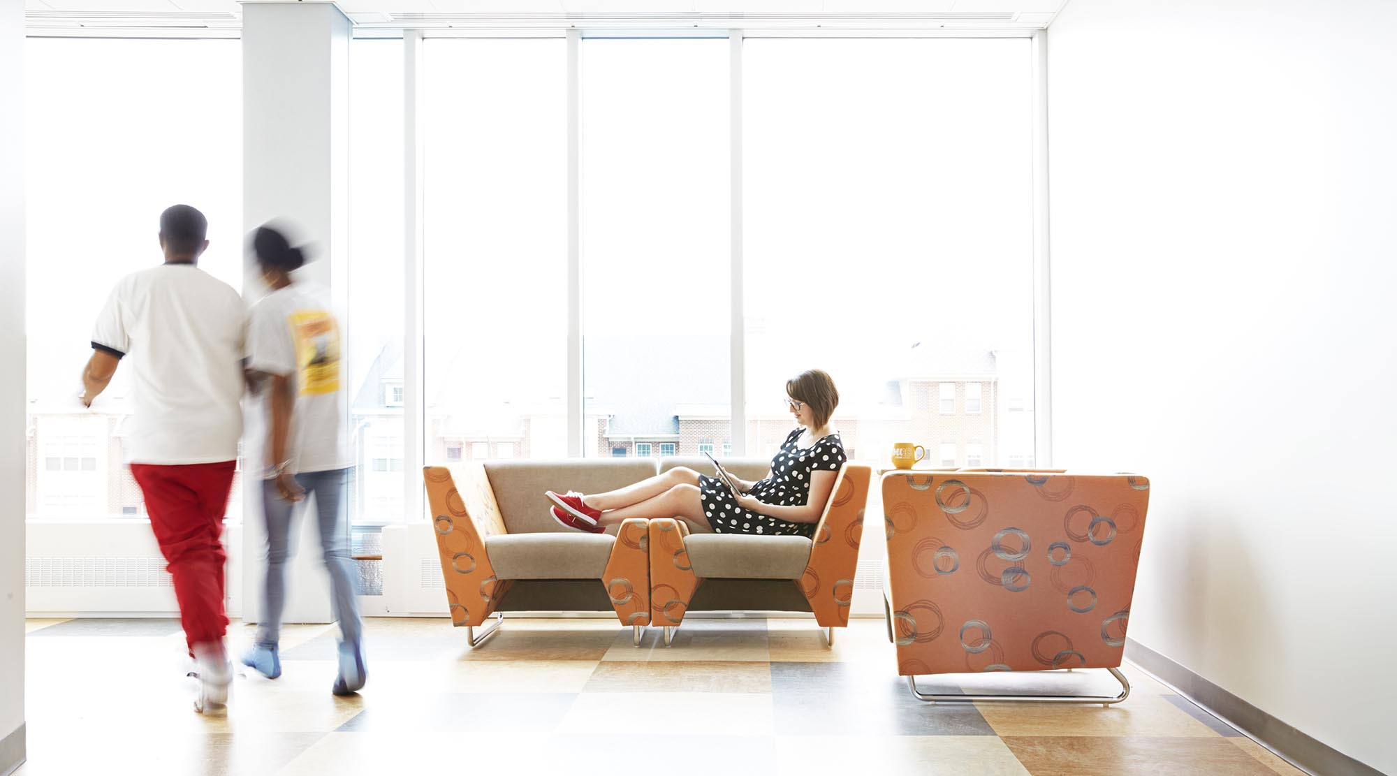 Students relax, study, and connect in a bright, comfortable MCC campus lounge.