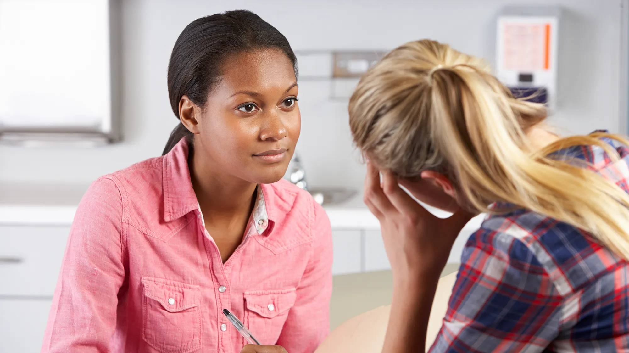 A counselor listening to a client