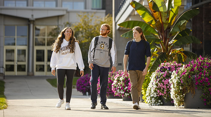 3 students walking outside of building 3
